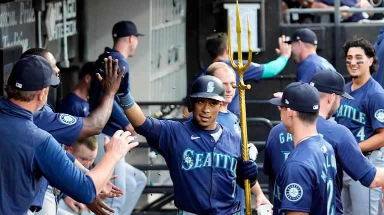 Seattle Mariners' Jorge Polanco celebrates his home run off Chicago...