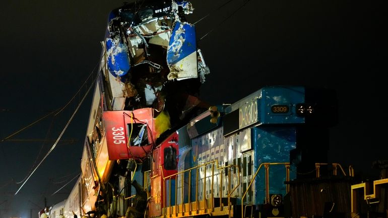 Police inspect two trains that collided in San Bernardo, Santiago,...