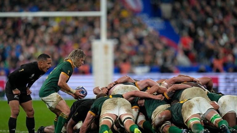 South Africa's Faf de Klerk prepares to feed the ball...