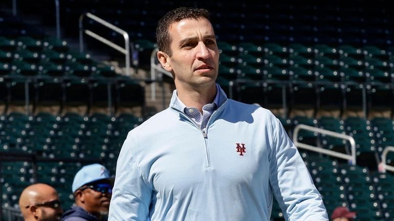 Mets President David Stearns walks on the field before a...