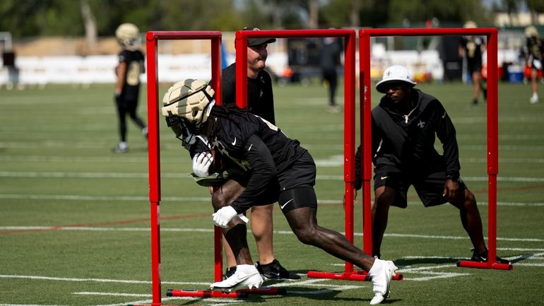 New Orleans Saints running back Alvin Kamara (41) runs with...