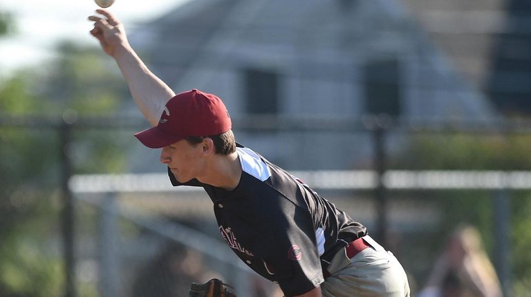 Tyler Cox #9, Clarke pitcher, delivers to the plate during...