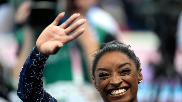 Simone Biles, of the United States, acknowledges the crowd during...