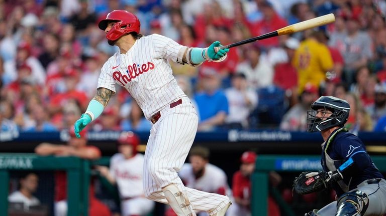 Philadelphia Phillies' Nick Castellanos watches his two run home run...