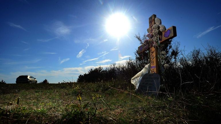 A makeshift memorial for a victim in the Gilgo Beach...