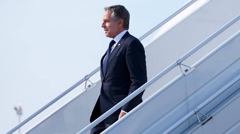 U.S. Secretary of State, Antony Blinken waves as he arrives...