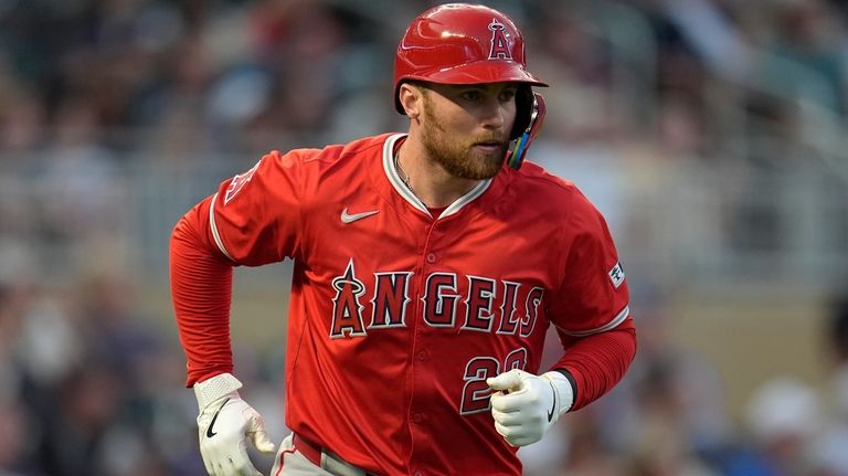 Los Angeles Angels' Brandon Drury runs the bases after hitting...