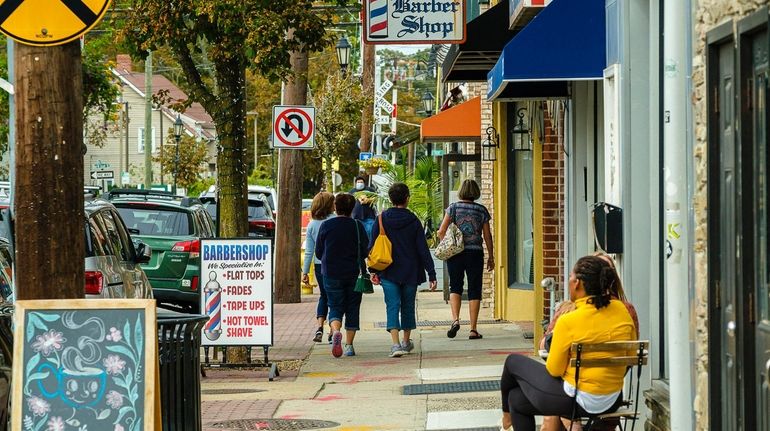 Pedestrians on Main Street in Farmingdale, as seen on Sept....