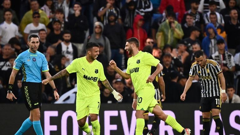 Sassuolo Domenico Berardi celebrates after scoring his side's second goal...