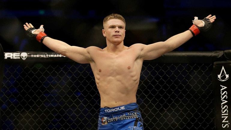 Chris Wade celebrates after beating Cain Carrizosa by submission due...