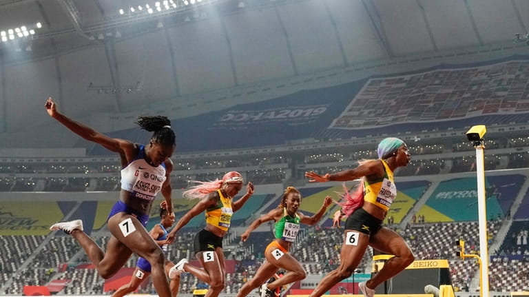 Shelly-Ann Fraser-Pryce (6), of Jamaica, finishes ahead of Dina Asher-Smith...