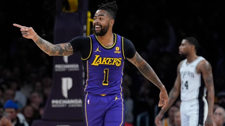 Los Angeles Lakers guard D'Angelo Russell (1) reacts after scoring...