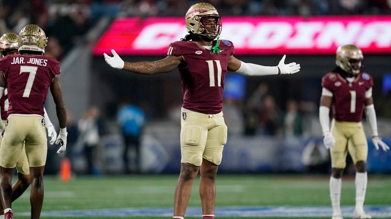 Florida State defensive lineman Patrick Payton reacts after a play...