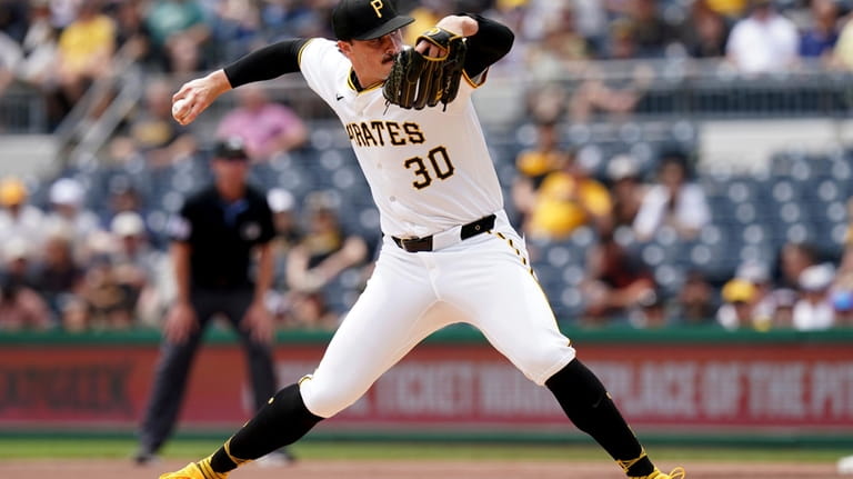 Pittsburgh Pirates starting pitcher Paul Skenes delivers during the first...