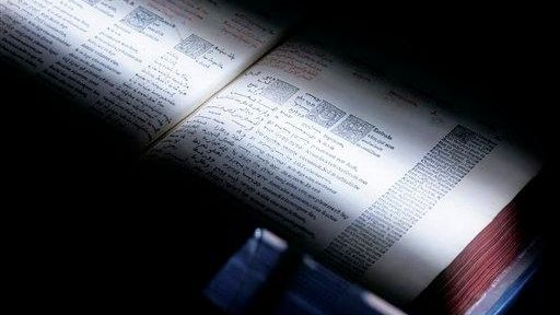 A scanner passes over a book at the University of...