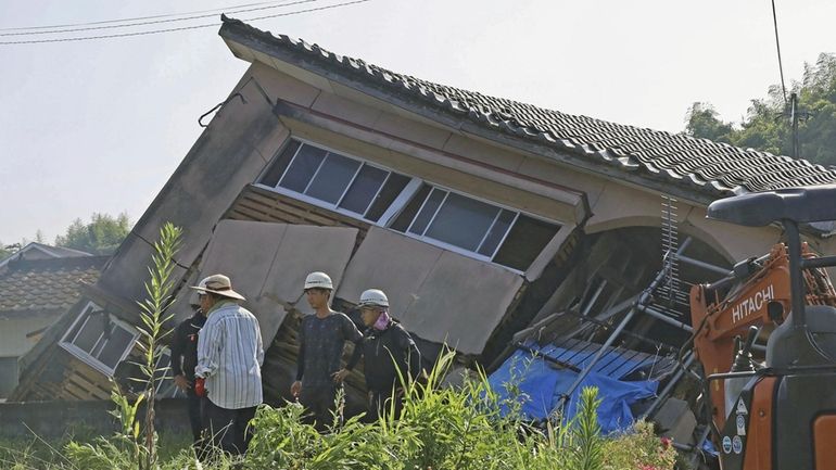 A house is seen collapsed in Oosaki town, Kagoshima prefecture,...