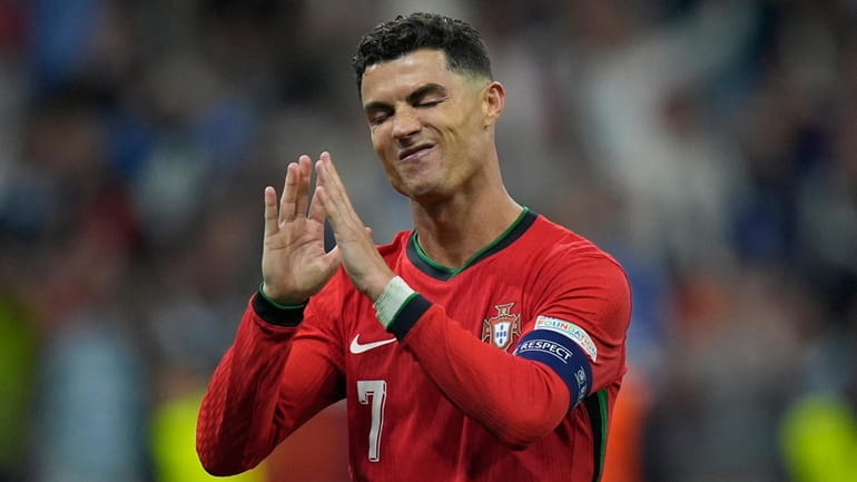 Portugal's Cristiano Ronaldo reacts after scoring in penalty shoot outs...