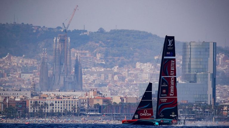 Backdrooped by the Sagrada Familia church, Emirates Team New Zealand's...