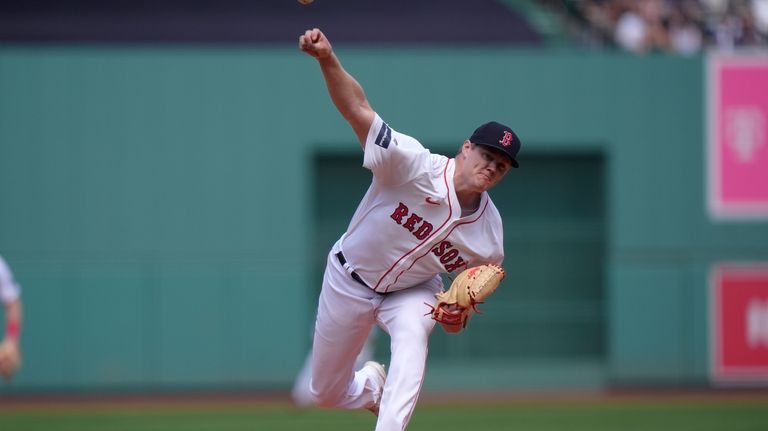 Boston Red Sox's Richard Fitts delivers a pitch to a...