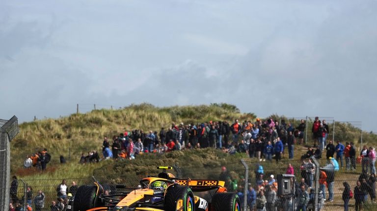 McLaren driver Lando Norris of Britain steers his car during...