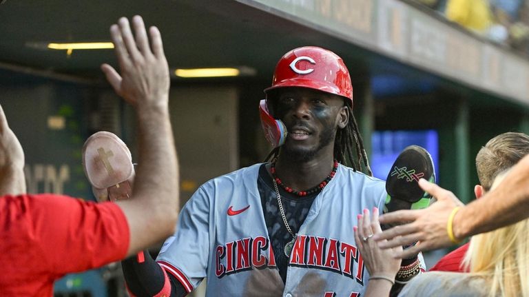 Cincinnati Reds' Elly De La Cruz (44) celebrates after scoring...