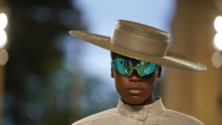 A model wears a creation by Louis Vuitton during a...