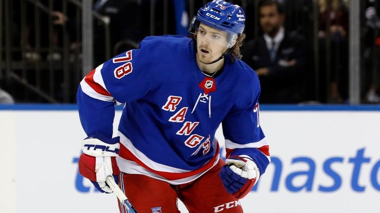 Brennan Othmann #78 of the New York Rangers skates against...