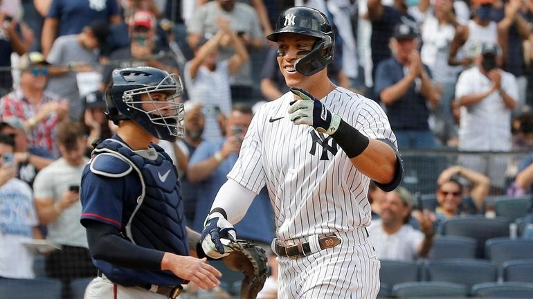 Aaron Judge of the Yankees celebrates his two-run home run in...