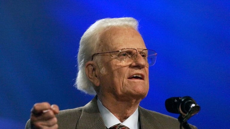 The Rev. Billy Graham addresses a gathering of about 40,000...
