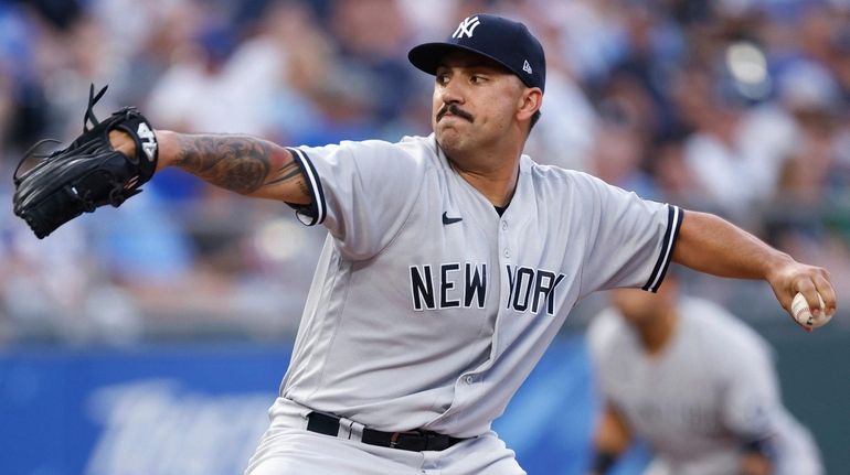 Yankees pitcher Nestor Cortes delivers to a Royals batter during the...