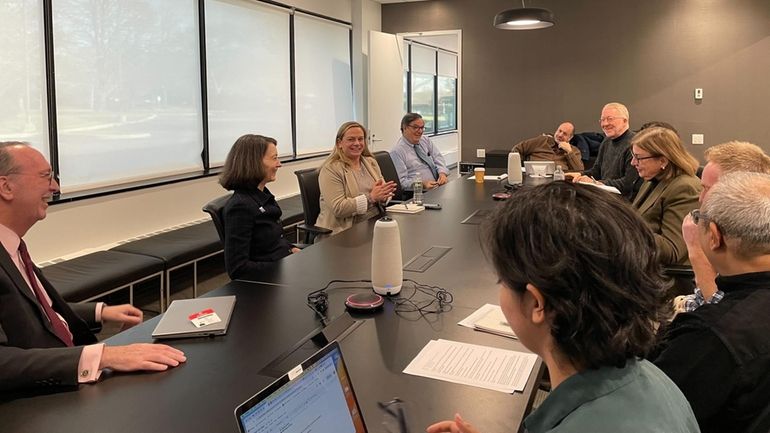 Hofstra University President Susan Poser, second from left, meets with...