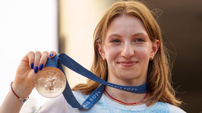 Romanian gymnast Ana Barbosu poses with the bronze medal for...