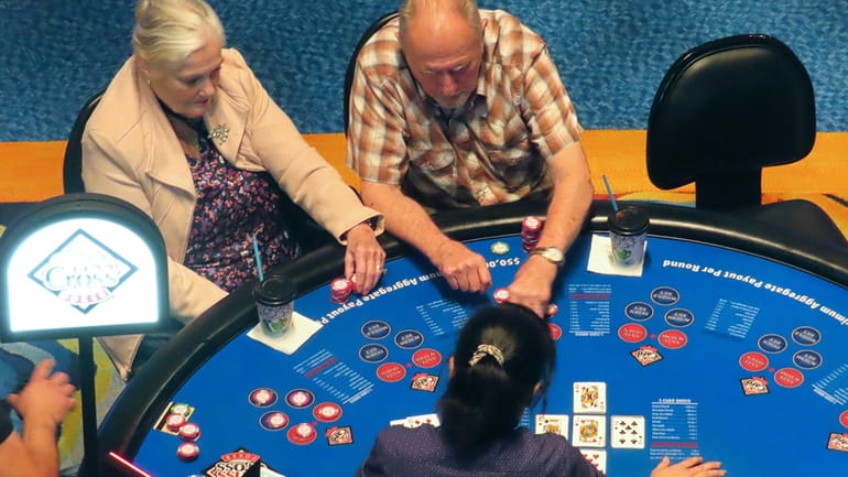 Gamblers play cards at the Ocean Casino Resort in Atlantic...