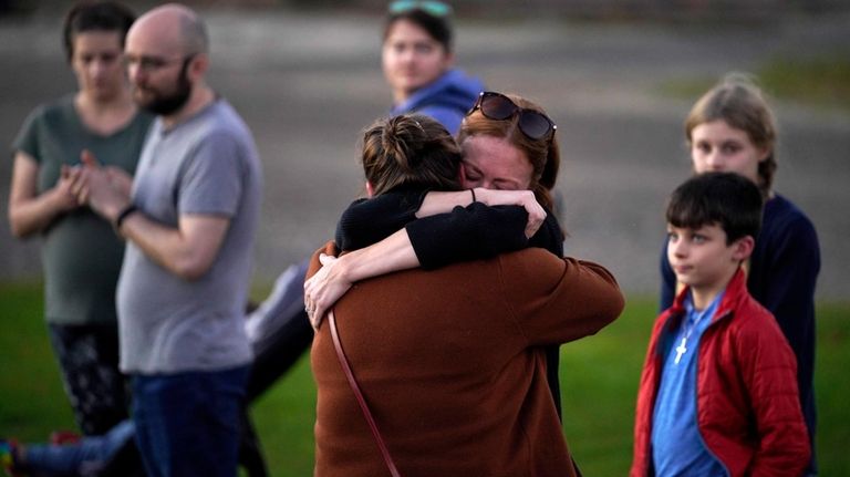 FILE — Lindsay Marlow, facing camera, hugs Courtney Majoros, Oct....