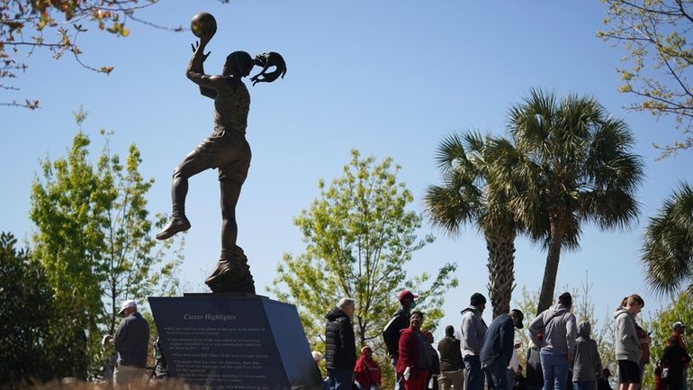 South Carolina basketball fans wait outside Colonial Life Arena near...