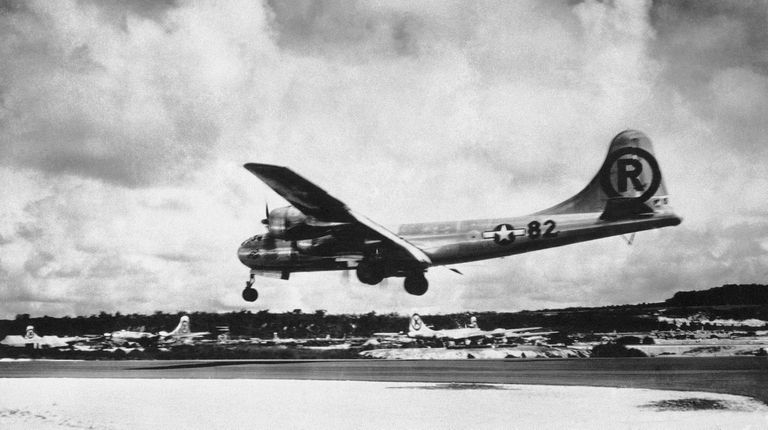 The Enola Gay lands at Tinian, Northern Mariana Islands, after completing the Hiroshima...