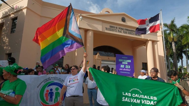 Abortion activists protest the proposal of a law, under debate...