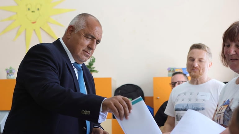 Bulgarian former Prime Minister Boyko Borissov casts his vote at...