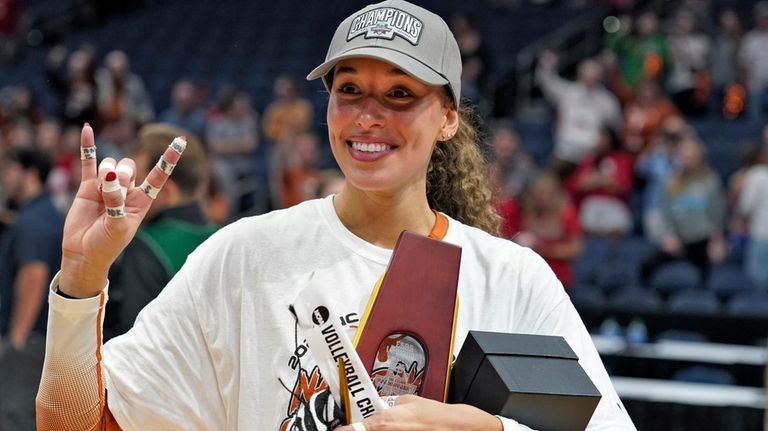 Texas's Madisen Skinner celebrates after the team defeated Nebraska during...