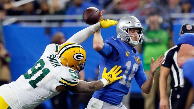 Green Bay Packers linebacker Preston Smith (91) strips the ball...