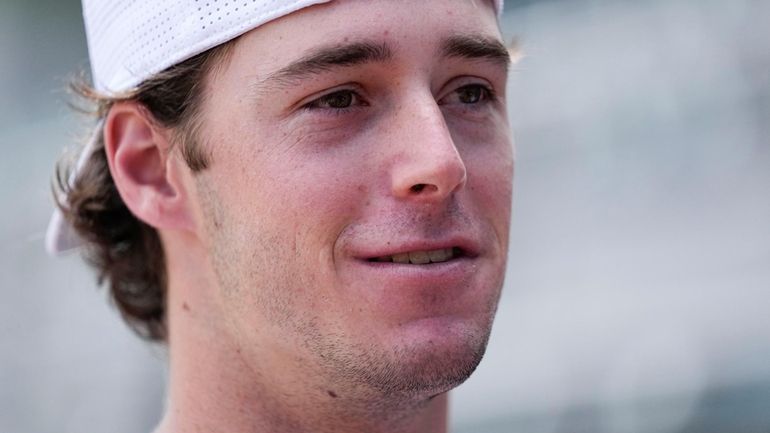 Georgia's Charlie Condon speaks to the media before an NCAA...