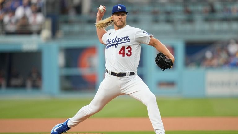 Los Angeles Dodgers starting pitcher Noah Syndergaard (43) throws during...