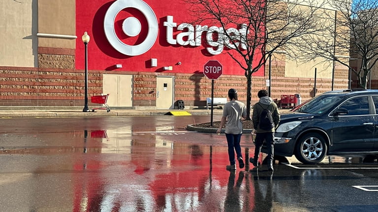 People walk towards a Target store in Clifton, N.J., on...