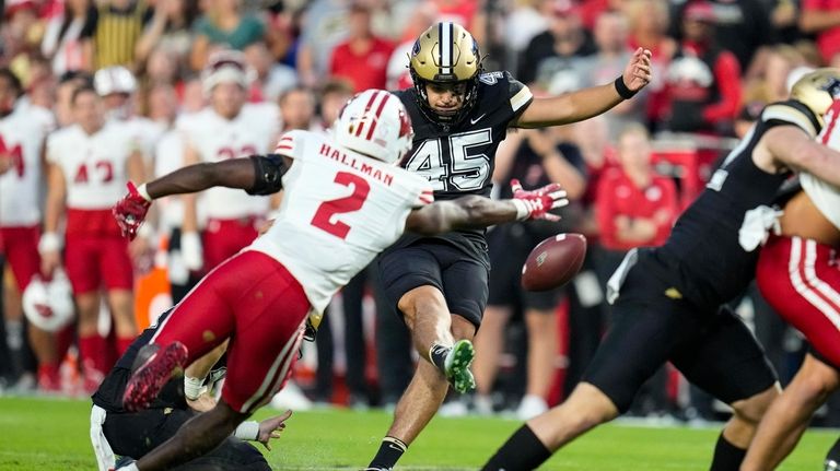 Purdue place kicker Julio Macias (45) kicks a field goal...