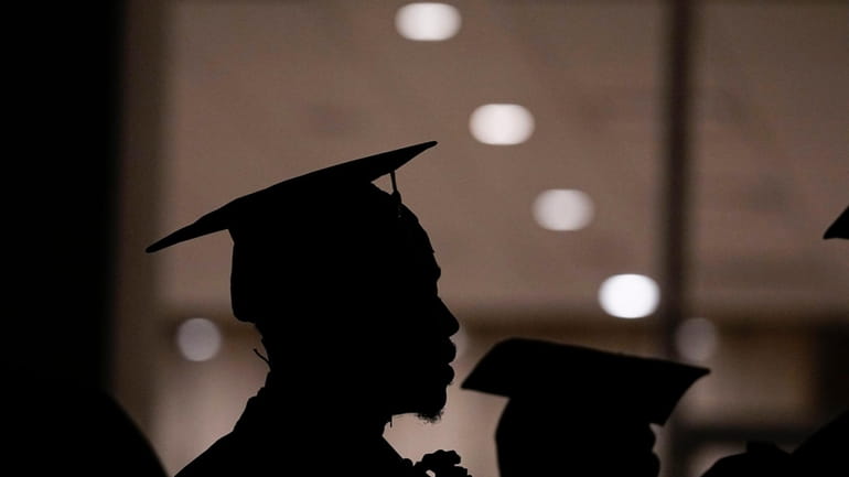 A Morehouse College student lines up before the school commencement,...