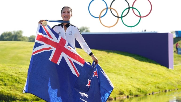 Lydia Ko, of New Zealand, poses for the cameras with...