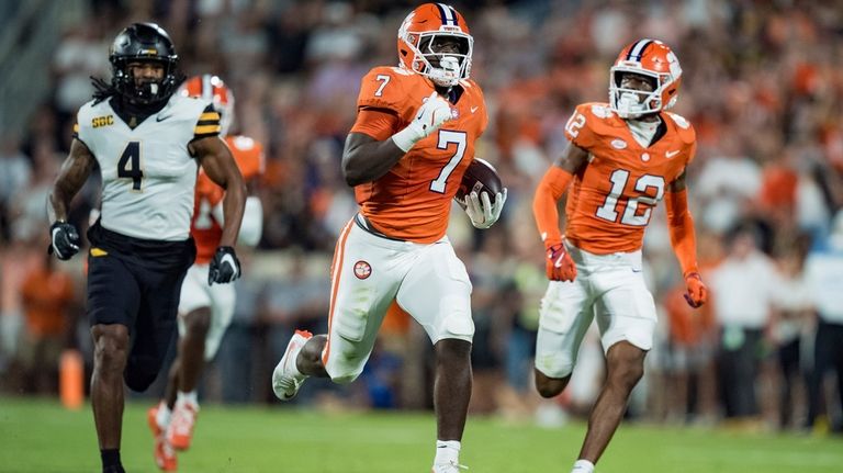 Clemson running back Phil Mafah (7) runs for a touchdown...