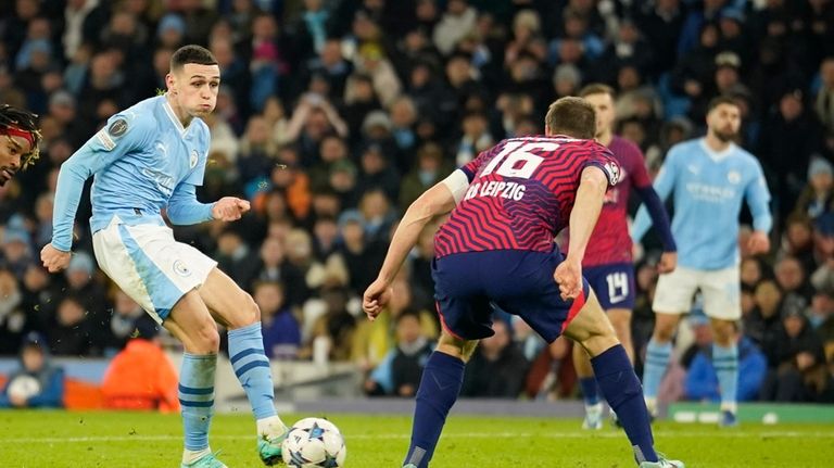 Manchester City's Phil Foden scores his side's second goal during...