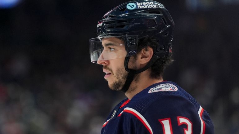 Columbus Blue Jackets' Johnny Gaudreau (13) awaits the face-off during...