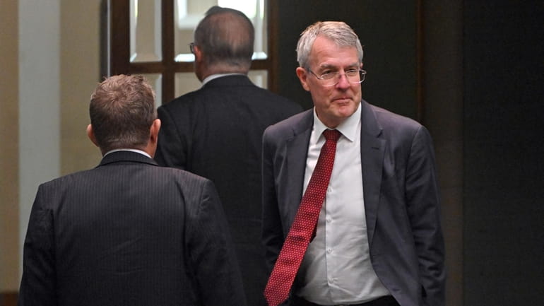 Australia's Attorney-General Mark Dreyfus leaves the house of representatives at...